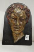 R De Rur, a part coloured bronze relief cast portrait plaque on a marble stand.