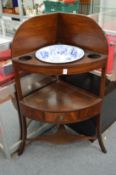 A 19th century mahogany corner washstand complete with blue and white porcelain bowl.