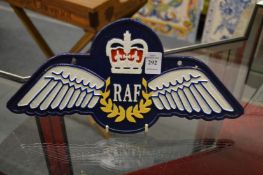 A novelty cast iron sign.