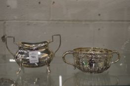A silver twin handled sugar bowl together with a silver twin handled bowl with embossed and engraved