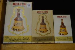 A graduated set of three Wade bells whisky decanters with original boxes.