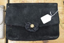 A ladies black velvet evening bag.