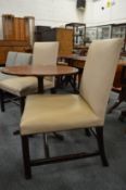 A pair of mahogany framed and leather cloth upholstered side chairs.