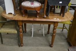 A pine kitchen table.