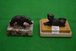 Small bronze model of a dog seated on a marble base together with a small bronze bear on a marble