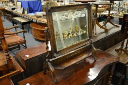 An oak dressing table mirror.