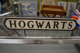 A novelty carved wood and painted sign.