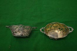 A pair of small silver twin handle basket shaped bonbon dishes.