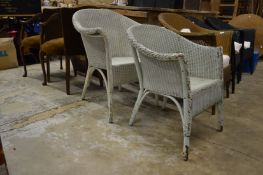 Two Lloyd Loom chairs.