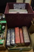 Dictionaries and a box of records.