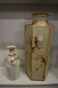 A large studio pottery slab vase and a similar smaller vase.