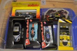 A group of six model Porsche racing cars.