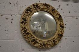 A convex wall mirror.