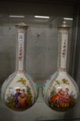 A pair of Dresden porcelain bottle vases painted with panels of figures and flowers (rim damaged and