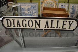 A novelty carved wood and painted sign.