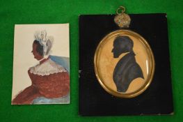 An early 19th century silhouette of a gentleman together with a colour silhouette of a lady.