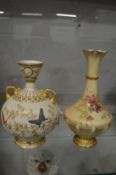 A Royal Worcester blush ivory twin handled bulbous vase painted with butterflies together with
