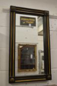 A rectangular wall mirror with ebonised frame.