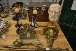 A brass inkstand, a cherub wall shelf, pair of decorative candlesticks and a plaster bust.