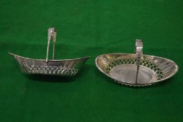 A pair of silver swing handled oval shaped bonbon dishes.