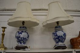 A pair of Chinese blue and white temple jar lamps.
