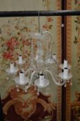 A Venetian style glass eight branch chandelier.