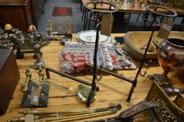 Firedogs, a brass skimmer and pair of wrought iron torcheres.