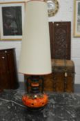 A 1960's-70's large Continental pottery table lamp with shade.