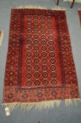 A small Persian design rug, red ground with stylised decoration 148cm x 93cm.