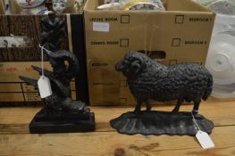 Two cast iron door stops.