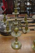 A brass Dutch style four branch five light candelabra.