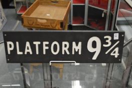 A novelty carved and painted wood sign.