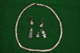 A silver chain, two pendants and earrings.