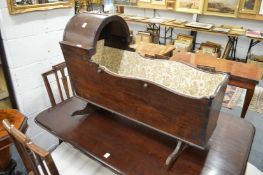 A 19th century mahogany cradle or crib.