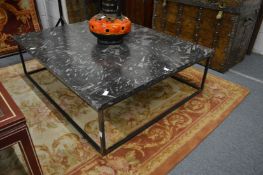 A good large fossilised marble top coffee table with wrought iron base.
