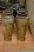 A pair of Japanese bronze and copper vases.