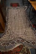 An Eastern textile throw or wall hanging.
