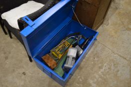 A metal trunk containing tools.