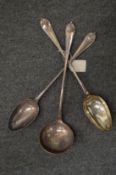 A pair of plated basting spoons and matching ladle.