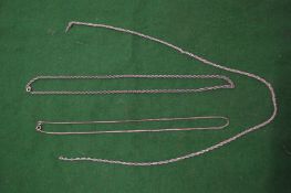 Three silver necklaces.