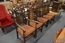 A set of five oak high back dining chairs, one with arms.