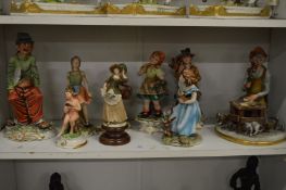 A quantity of Capodimonte figures.