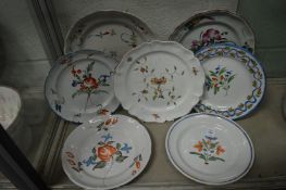 Seven Continental floral decorated plates.