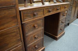 A Victorian mahogany kneehole desk or dressing table.