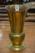 A brass trumpet shaped vase.