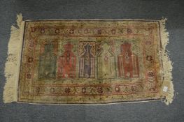 A small Persian design prayer rug 100cm x 58cm.