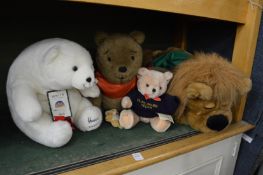 A Harrods polar bear and other soft toys.