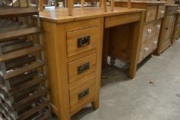 A modern oak pedestal desk.