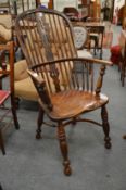 A 19th century ash and elm Windsor armchair.