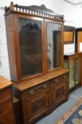 A Victorian walnut cupboard bookcase.
